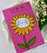 Load image into Gallery viewer, sterling silver lily flower earrings on a sunflower design card - bright and cheerful