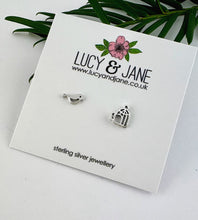 Load image into Gallery viewer, sterling silver mismatched earrings of a bird and birdcage on a Lucy and Jane backing card