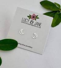 Load image into Gallery viewer, sterling silver open moon studs on a lucy and jane backing card