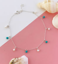 Load image into Gallery viewer, Silver anklet with pearls and turquoise beads on a pink surface with seashells.
