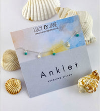 Load image into Gallery viewer, stelring silver anklet with tiny freshwater pearl and turquoise beads hanging off it. Displayed on a Lucy and Jane Anklet card