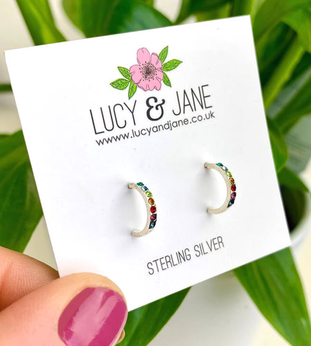 sterling silver rainbow small hoops on a Lucy and Jane backing card