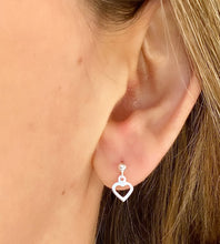 Load image into Gallery viewer, sterling silver drop heart studs in model&#39;s ear