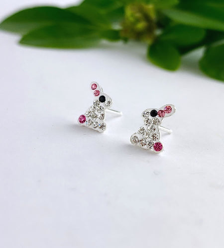 sparkly sterling silver rabbit studs with clear and pink crystals.