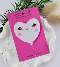 Load image into Gallery viewer, super sparkly pink and red heart studs on a valentine backing card.  Lucy and Jane branding and sterling silver on the heart backing card