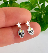 Load image into Gallery viewer, sterling silver star stud with skull hanging off them.