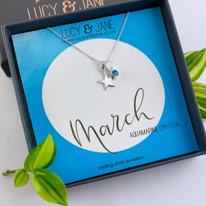 sterling silver star birthstone necklace for march with an aquamarine crystal