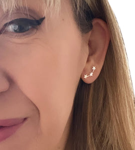 sterling silver three stars earring on model's ear