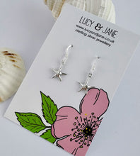 Load image into Gallery viewer, sterling silver starflsh dangly earrings on a Lucy and Jane card
