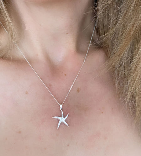 sterling silver starfish necklace on model