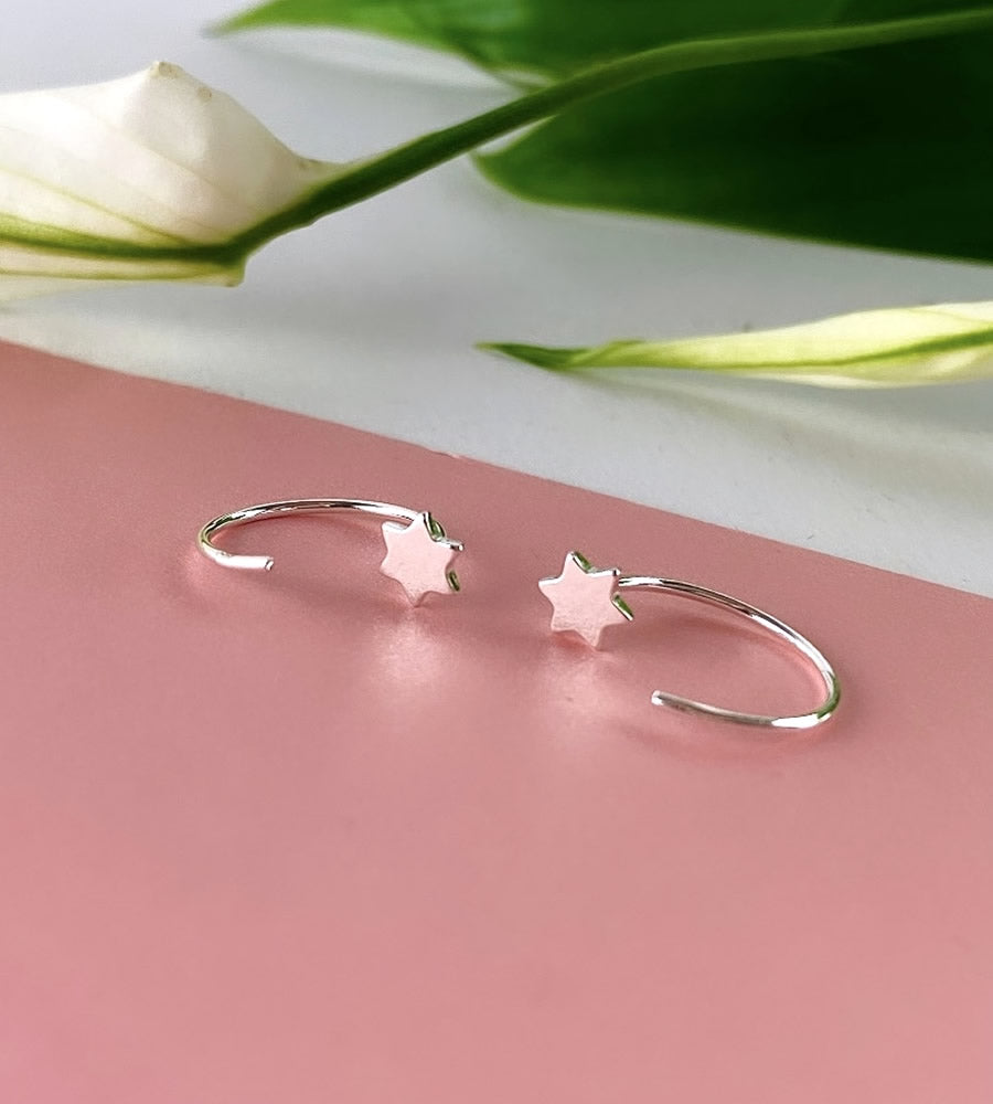 sterling silver star pull through earrings.  Easy to wear no ear fastening needed