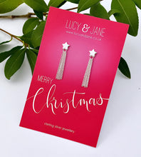 Load image into Gallery viewer, sterling silver star studs with long silver tassles hanging off them.  The long star earrings are on a Merry Christmas backing card