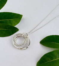 Load image into Gallery viewer, sterling silver three circles necklace, each circle is a different size and textured to catch the light