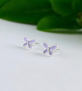 tiny sterling silver butterfly studs in a light purple colour