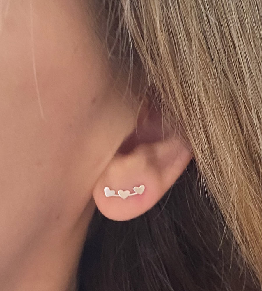 sterling silver mini heart climber earrings in models ear