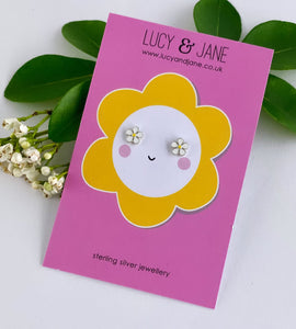 sterling silver tiny daisy studs on a limited edition pink and yellow flower card