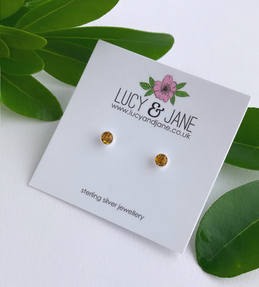 small sterling silver dark yellow crystal studs