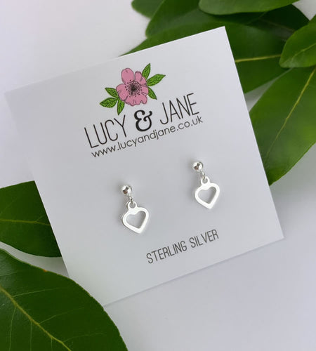 sterling silver small heart drop earrings on a white card