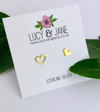 Load image into Gallery viewer, mismatched gold heart ear studs with one solid heart and one open heart stud