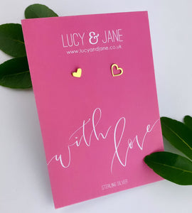 mismatched gold heart studs on a with love messge card