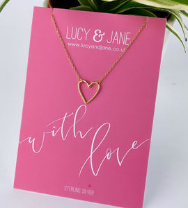 simple gold heart necklace on a with love card