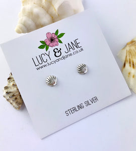 Sterling silver shell studs on a white card
