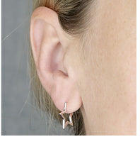 Load image into Gallery viewer, model wearing sterling silver star hoops