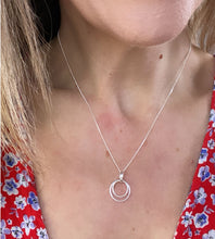 Load image into Gallery viewer, model wearing the sterling silver circles necklace