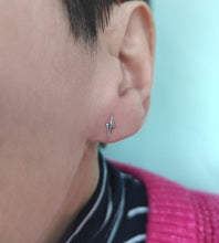 Load image into Gallery viewer, small sterling silver lightning bolt studs on a model&#39;s ear