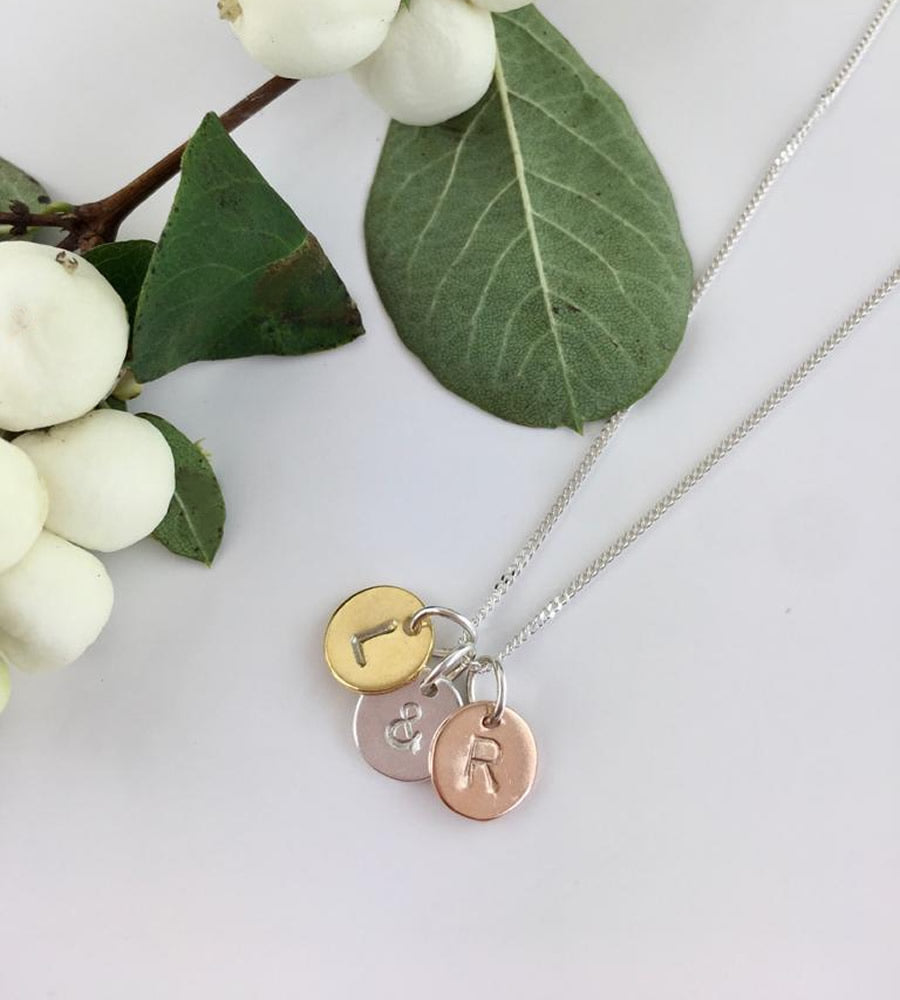 personalised initials necklace with three letters - one initial in gold, one initial in silver and the third initial in rose gold